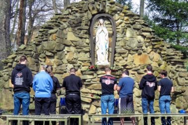 group praying in the Marian Grotto